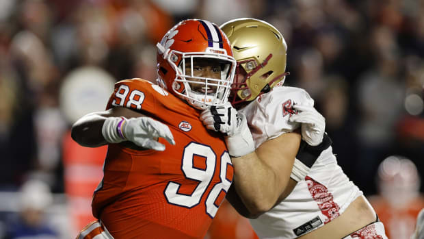 Oct 8, 2022; Chestnut Hill, Massachusetts, USA; Clemson Tigers defensive end Myles Murphy (98) fights to get past Boston College Eagles offensive lineman Ozzy Trapilo (70) during the second quarter at Alumni Stadium. Mandatory Credit: Winslow Townson-USA TODAY Sports